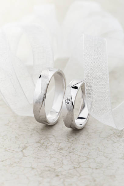 istock Pair of silver wedding rings 1209614206