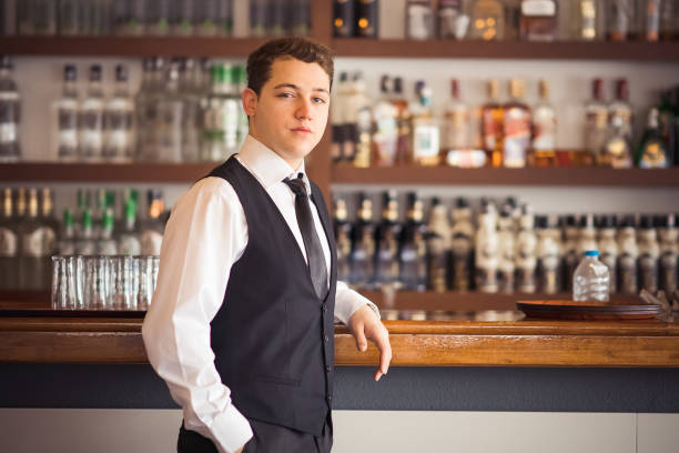 istock Young businessman at bar counter 1209617433