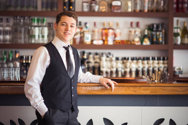 istock Young businessman at bar counter 1209618056