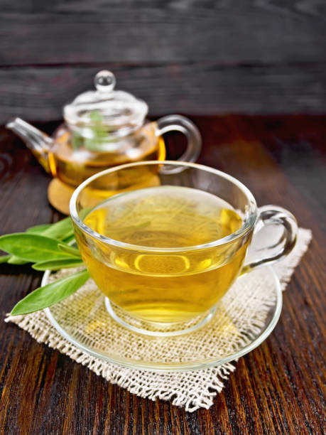 istock Tea herbal with sage in glass cup on napkin 1209621159