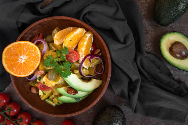 istock Vegan avocado, orange and tomato salad 1209624693