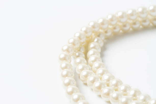 istock pearl necklace isolated on white blackground 1209626261
