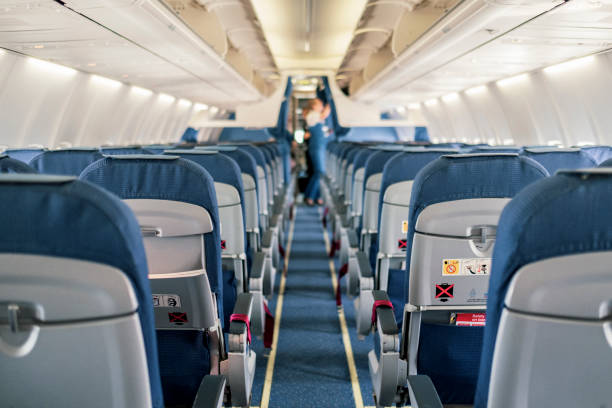Empty Airplane Cabin Interior Empty airplane cabin interior seat stock pictures, royalty-free photos & images