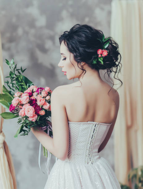istock elegant bride with hair and makeup 1209626593