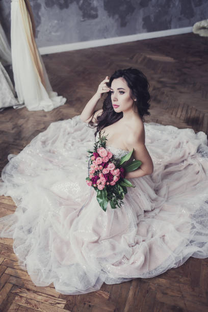 istock bride brunette with flowers 1209626640