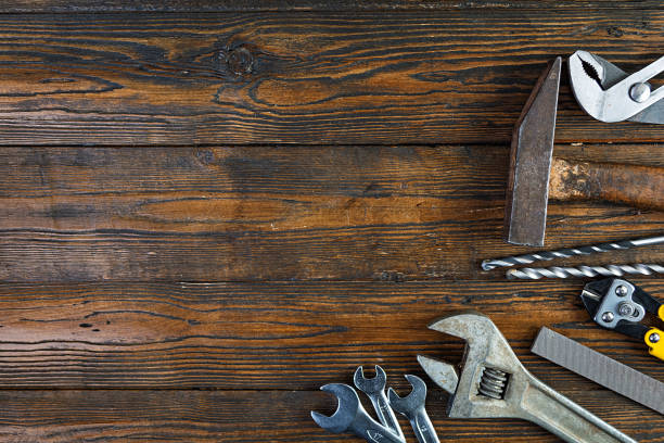 istock Set of working tools on wooden rustic background. Top view. Copy space 1209627362