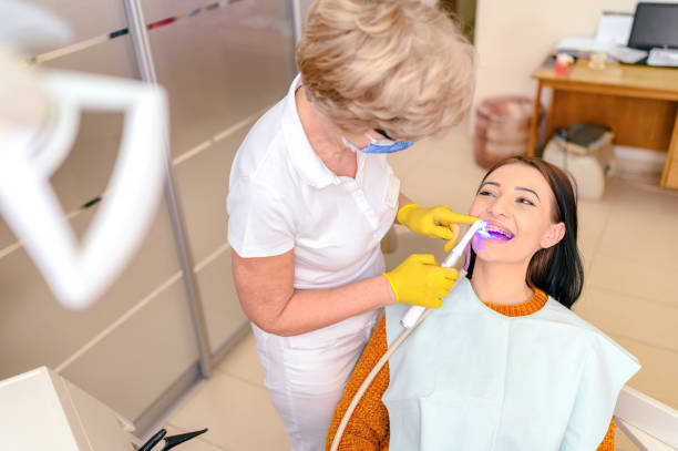 istock Ultraviolet light procedure at dentist office 1209629769