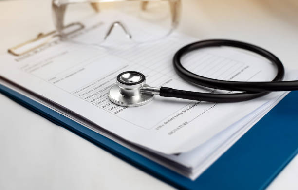 istock The stethoscope put on insurance claim form,blurry light around 1209629914