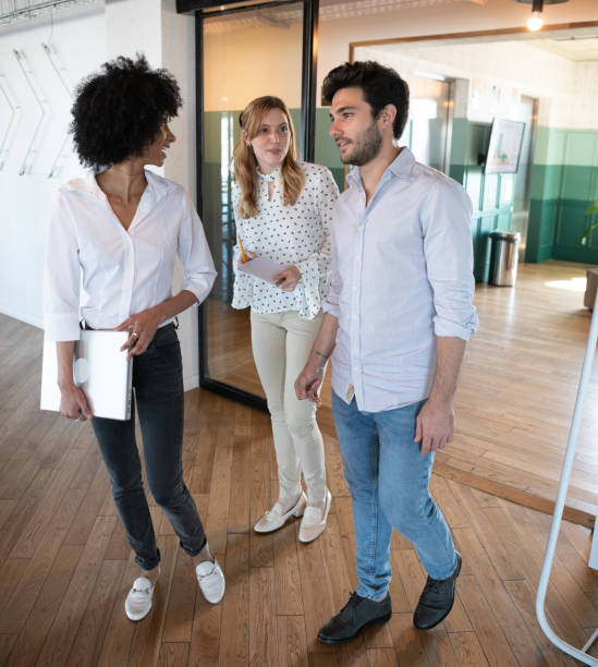 istock Mixed business walking in office, Buenos Aires 1209630149