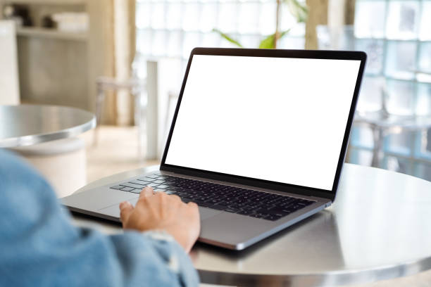 istock a woman using and touching on laptop computer touchpad with blank white desktop screen 1209631344