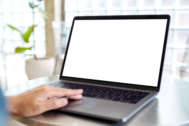 istock a woman using and touching on laptop computer touchpad with blank white desktop screen 1209631903