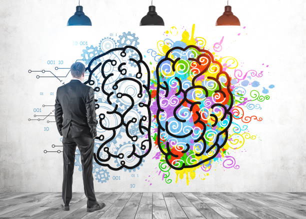istock Businessman looking at left and right brain 1209633164