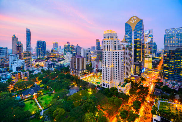 Bangkok Downtown Silom City Skyline at Sunset, Thailand Illuminated Buildings at Twilight with Glowing Sunset Sky silom stock pictures, royalty-free photos & images