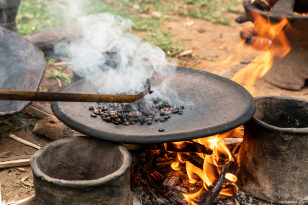 Roasting of coffee beans on a flat pan in a village in southern Ethiopia
