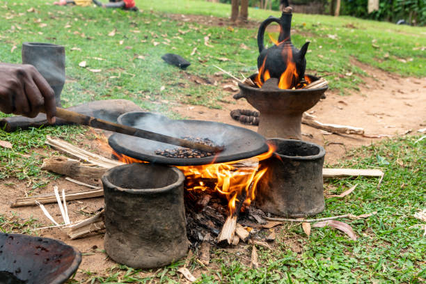 Roasting of coffee beans on a flat pan in a village in southern Ethiopia