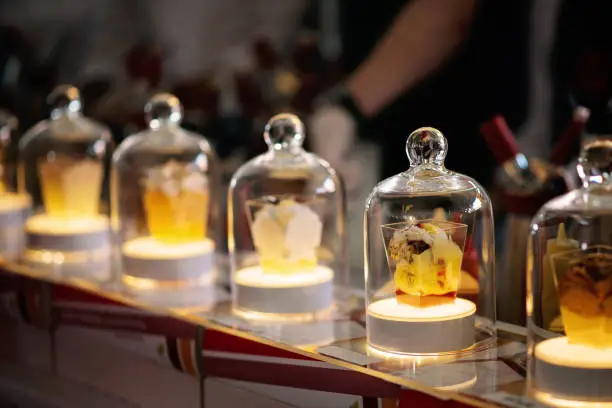 A spectacular presentation of molecular cuisine in a glass flask with backlight...