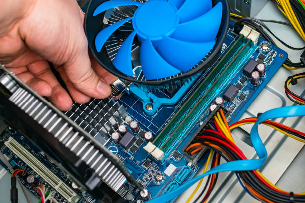 istock Computer repair, replacement of the processor cooling system. Maintenance of computer equipment. 1209638201