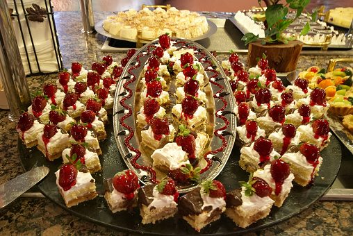 Turkish small cakes. Traditional Turkish delight in the hotel buffet in Turkey. Antalya region, South Turkey