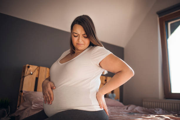 istock Highly pregnant woman has back pain 1209643723