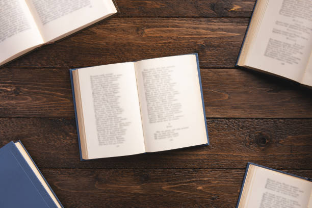 istock Books isolated on wooden background. Flat lay, top view, copy space. 1209644559