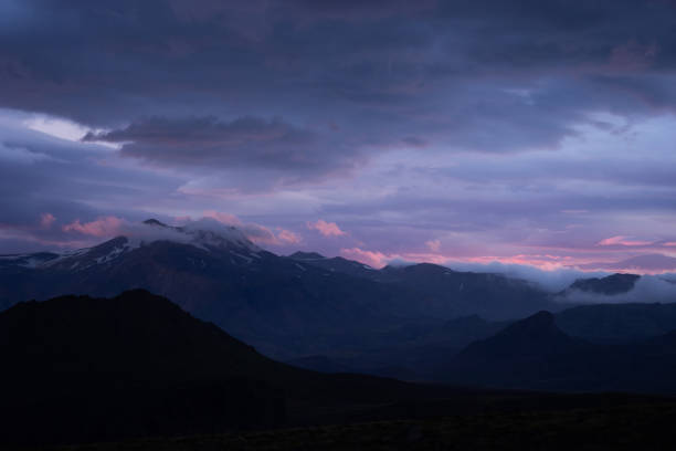 istock Mountain peak with snow and clouds during dramatic and colorful sunset on the laugavegur Hiking trail close to Thorsmork 1209646605