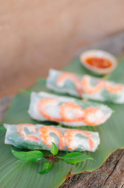 istock Summer Roll, Salad roll, Fresh Spring Roll, Vietnamese Food. It is made from rice paper, prawns, vegetable and used with fish sauce 1209647830