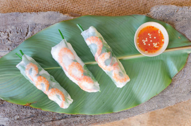 istock Summer Roll, Salad roll, Fresh Spring Roll, Vietnamese Food. It is made from rice paper, prawns, vegetable and used with fish sauce 1209647877
