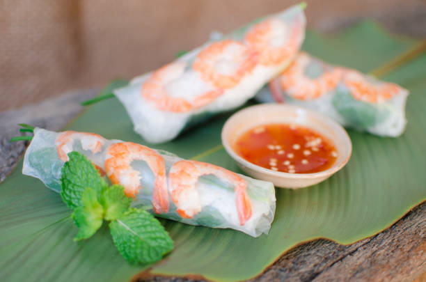 istock Summer Roll, Salad roll, Fresh Spring Roll, Vietnamese Food. It is made from rice paper, prawns, vegetable and used with fish sauce 1209647975