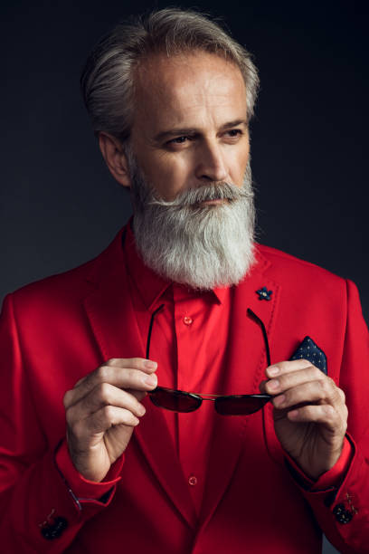 istock Happy well dressed gentleman having photoshooting in studio 1209649011