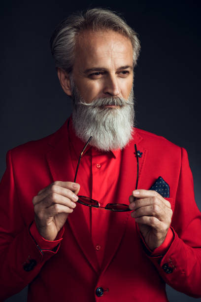 istock Happy well dressed gentleman having photoshooting in studio 1209649084