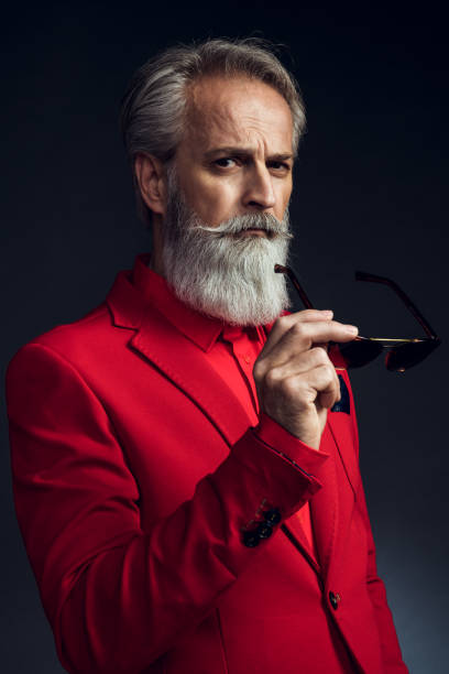 istock Happy well dressed gentleman having photoshooting in studio 1209649091