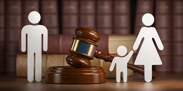 Divorce and custody child concept. Gavel and family silhouette on book background. 3d illustration