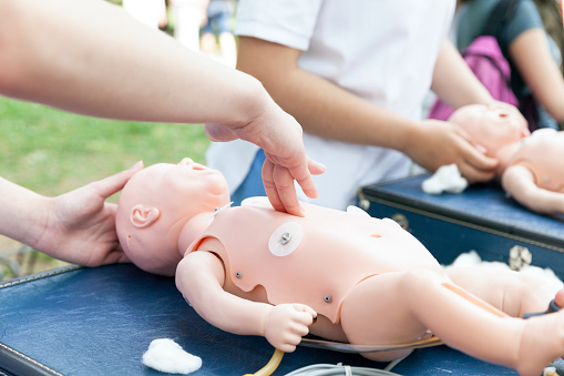 CPR - Cardiopulmonary resuscitation and first aid class for a baby