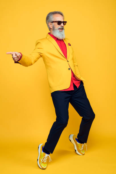 istock Happy well dressed gentleman having photoshooting in studio 1209650651
