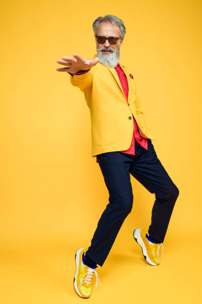 istock Happy well dressed gentleman having photoshooting in studio 1209650663