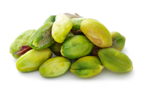 heap of peeled pistachio nuts isolated - raw food green freshness imagens e fotografias de stock