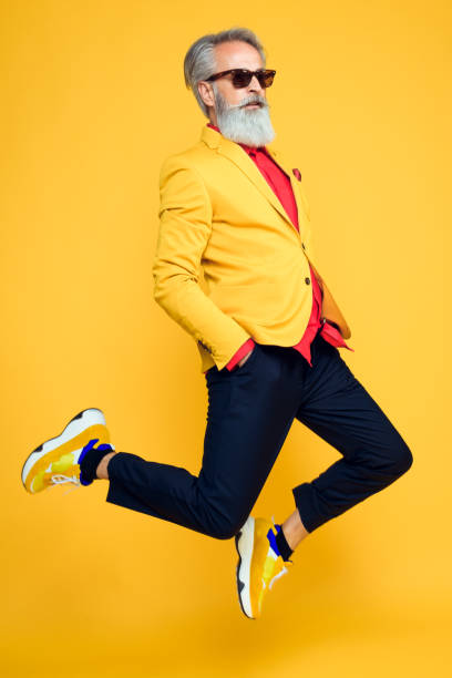 istock Happy well dressed gentleman having photoshooting in studio 1209651696