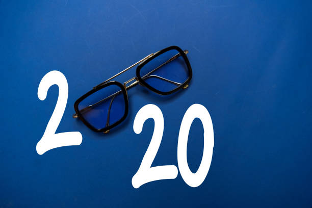 istock Happy New Year 2020 with Glasses isolated on the color table 1209652465