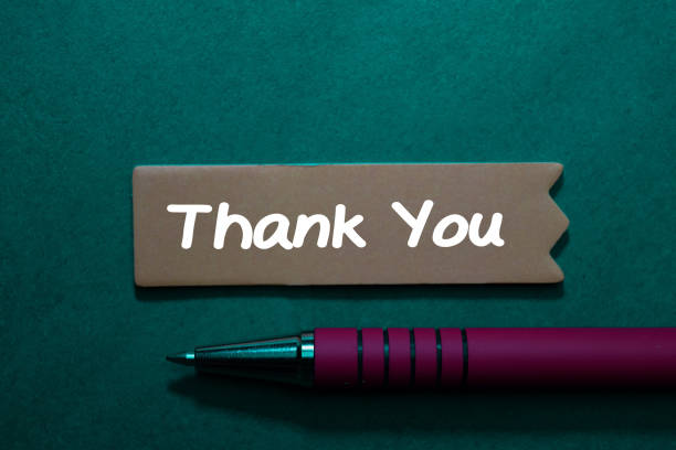 istock Thank You write on sticky note isolated on Office Desk. 1209652556