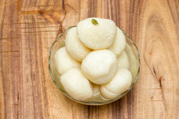 famous Bengali sweet "Rasgulla" is ready to serve famous Bengali sweet "Rasgulla" is ready to serve rosogolla stock pictures, royalty-free photos & images