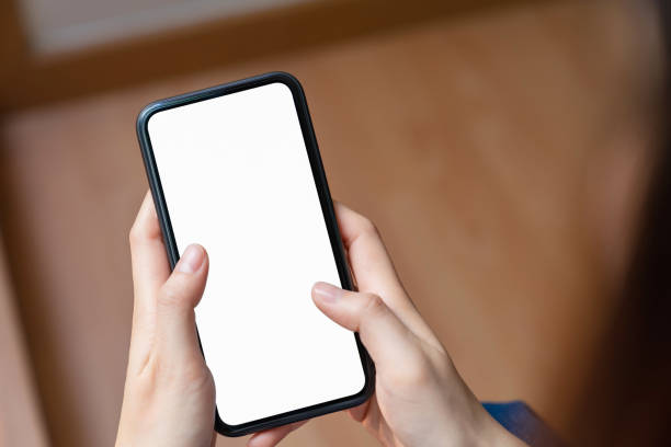 istock Hand holding blank screen of smartphone and for graphic display montage. 1209657895