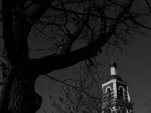 Church tower is glowing in the dark sky