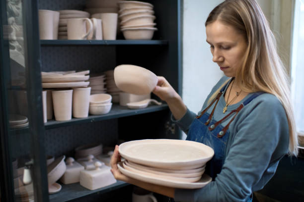 istock Young woman in her pottery workshop 1209662522