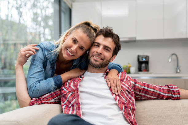 istock Loving couple smiling at home 1209669690