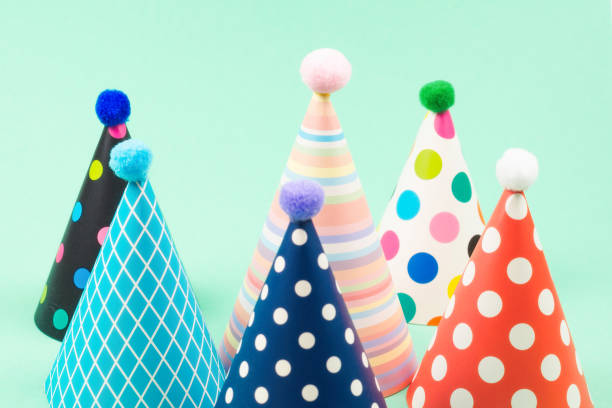 istock Colorful birthday caps on mint background. 1209672091