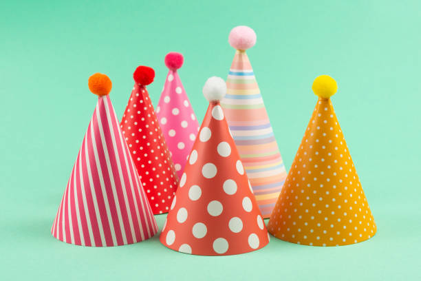 istock Colorful birthday caps on mint background. 1209672116