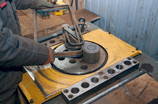 Equipment for bending steel rods at a construction site. Equipment for construction. The rebar bend machine
