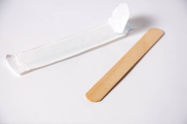 The subject for a medical examination of the oral cavity of a sick person on a white background Medical spatula for examining the oral cavity. Close-up medical subject for examination of the mouth on a white background new britain island stock pictures, royalty-free photos & images