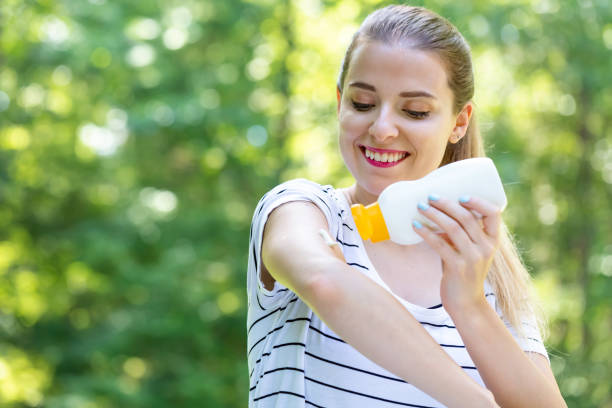 istock Young woman with sunscreen 1209672680