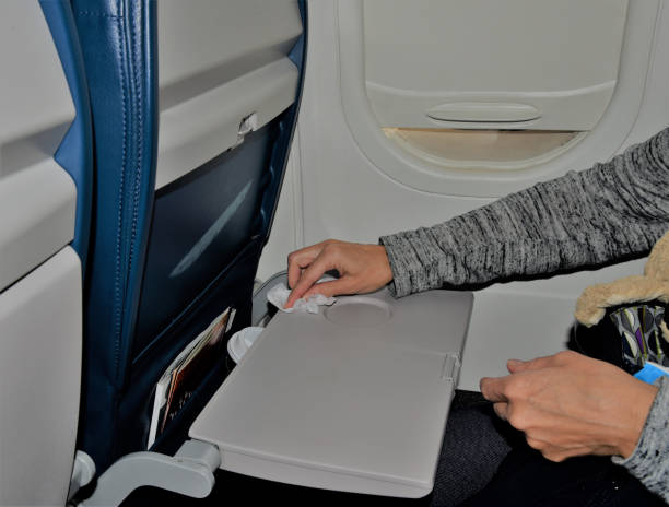 istock Wiping dirty airplane tray 1209672755